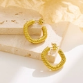 French vintage style twisted rope gold hoop earrings on a textured stone display - E126 Twisted Hoop