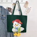 Detail of cute white duck print on dark green canvas tote bag with 3D yellow plush feet - Dark Green