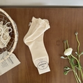 Cream knit mid-calf socks with ruffle trim and pink silk bow accent in gift packaging - One Size / Cream Rice
