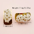 Elegant gold earrings with white flower clusters and size measurements shown - 1.4cmx2.7cm