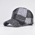 Detailed view of the textured plaid wool blend fabric on a structured baseball cap - Adjustable / Black and Grey Patchwork