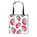 White canvas tote bag featuring vibrant strawberry prints and black webbing handles - White Strawberry Leaf Print