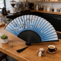Blue gradient folding fan with white cherry blossom prints and a black silk tassel - Style 68 (New Style)