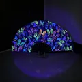 Detail of bamboo folding fan with fluorescent butterfly pattern glowing under UV light - Butterfly Fantasy UV Glow A57