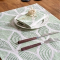 Japanese style green polka dot linen placemat and napkin set on a dark wood table - Green Barley Seedling