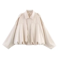 Detailed close-up of cream faux leather bomber jacket with batwing sleeves and cropped hem - XS / Off White