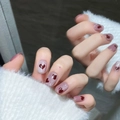 Detailed view of handmade short cat-eye press-on nails featuring red heart patterns - Extra Small (XS) / Ultra Short Coffin / Wine Red Cat Eye Heart Style