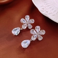 Detailed view of luxury zircon flower earrings with a large sparkling waterdrop pendant - Silver Pin - Silver Flower Teardrop Earrings