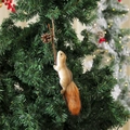 Close-up of a lifelike foam squirrel ornament with a fluffy tail on a Christmas tree - Style 11 (33x6x8cm)