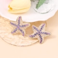 Sparkling purple rhinestone starfish earrings with pearls on a golden base design - Purple