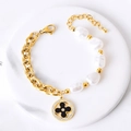 Bracelet en acier titane doré avec perles irrégulières et pendentif fleur en cristaux - Fleur