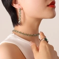 Silver jewelry set with green zircon stones featuring necklace, earrings and ring on model - F640-Silver Color Light Green Zirconia Earrings