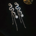 Detailed shot of silver snake earrings with crystals, long metal tassels and white pearls - Snake Shape Pearl Long Style (5#)