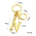 Golden letter N alphabet keychain with dimensions and weight specs on white background - Letter N