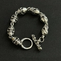 Detailed close-up of retro silver skull link bracelet with vintage T-bar toggle clasp - No.1 Skull 24cm