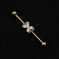 Macro view of gold industrial piercing bar with butterfly clear zircon stone detail - Gold/Bow Butterfly/White Zircon