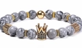 Men's beaded bracelet featuring grey marble beads and a gold crown charm with black zircons - Elastic Beaded Style / Map Stone