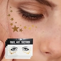 Face art tattoos with golden star patterns for sparkling festival and party makeup looks - Style 9