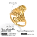 Macro view of gold flower leaf pattern on adjustable stainless steel open ring - Ginkgo Leaf Design (JDR0207009)