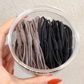 Elastic hair ties in black and beige tones stored in a clear round plastic container - 20 PCS (OPP Bag) / Grey + Black