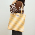Yellow and white striped canvas tote bag with Refreshing Day label for casual daily use - Single Layer Stripe - Orange