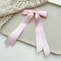 Detailed view of pink satin double-layered bow hair clip with long silk ribbon tassels - Light Pink