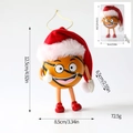Cute basketball Christmas ornament with cartoon face, Santa hat, and golden hanging cord - Funny Expression Basketball