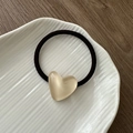 Detailed view of a sweet resin heart hair tie on a white ceramic tray with wooden background - Jelly Heart Hair Tie-White