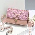 Elegant pink handbag with sequin flap, heart buckle, and gold chain handle in studio view - 21x8x14cm / Pink