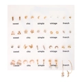 Macro shot of 15 pairs heart and pearl stud earrings set on a white sweet chic display card - 15 Pairs Gold Set (E0765-2)