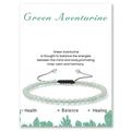 Close-up of Green Aventurine beaded bracelet on a descriptive display card with black cord - Green Aventurine Bracelet