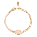 Detail of pink enamel feather charm on gold bead bracelet with stainless steel chain - Pink