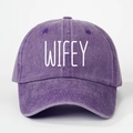 Detail view of purple washed cotton baseball cap with white WIFEY embroidery lettering - Purple