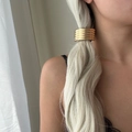 Detailed view of layered gold alloy ponytail cuff hair wrap on blonde hair accessory - Multi-ring Style Gold