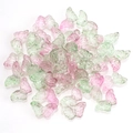 Close-up of 15mm butterfly crystal glass beads with pink and green gradient colors - Green and Pink