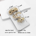 Three minimalist gold alloy ponytail hairpins in various sizes on a white display stand - 3-Piece Set No. 9 (MY030-9)