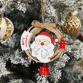 Wooden Christmas wreath with Santa, bow, and red bell on snowy pine branches - Wooden Santa Claus Pendant