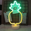 Pineapple LED neon lamp with green and yellow glow on a white circular base - Bicolor Pineapple