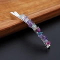 Detailed macro view of silver hair clip with colorful irregular natural crystal stones - Fluorite with Silver Clip