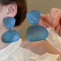 Close-up of model wearing blue irregular geometric resin hoop earrings with French retro style - 28# Silver Earring Post-Blue (Blue Irregular Geometric)
