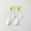 Casual white crew socks with yellow heart pattern and ribbed elastic cuffs - White