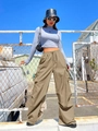 Macro shot of khaki cargo pants with large side pockets and drawstring waist detail - S / Khaki