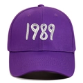 Detailed close-up of 1989 embroidery on a purple cotton canvas baseball cap - Purple