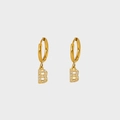 Close-up of gold plated stainless steel earring with letter B pendant and white zircon stones - Letter B