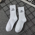 White mid-calf crew socks with black GO AWAY letters and athletic ribbed cuffs - Go Away