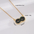 Collana infinito placcata oro con intarsio nero, paillettes e zirconi bianchi - Nero