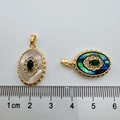 Detailed size measurement of 18K gold plated emerald shell charms with a ruler display - Oval Emerald Abalone Shell