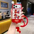 Detailed view of red checkered iPhone case with Lucky embroidery and plush horse charm - Pp Spring Festival Red Bow Pony + Handbag / iPhone15