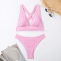 Detailed flat lay of pink ribbed halter bikini with straw hat and sunglasses accessories - S / Pink