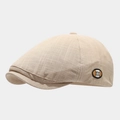 Beige plaid newsboy cap with vintage octagonal design and metal M logo accent - One Size / Beige
